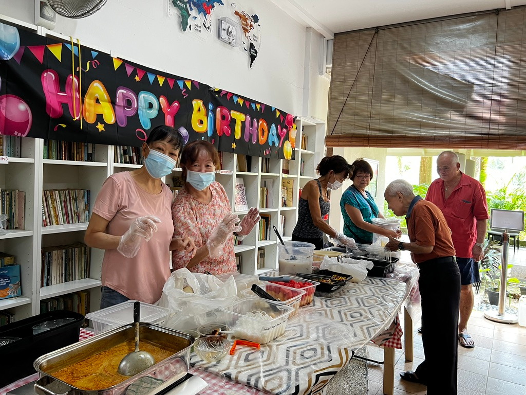Volunteers serving meals together during a Hotel Food Share